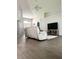 Bright and airy living room with hardwood floors, neutral colors, and modern furnishings at 33632 Wesley Rd, Eustis, FL 32736