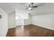 Bonus room with ceiling fan, wood-look flooring and staircase at 6017 Westgate Dr # 924, Orlando, FL 32835