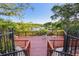 A scenic wooden deck overlooking a tranquil lake, offering a peaceful retreat for residents with outdoor seating at 6017 Westgate Dr # 924, Orlando, FL 32835