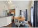 Bright dining area features a round table, lovely chairs, and natural light from the nearby window at 6017 Westgate Dr # 924, Orlando, FL 32835