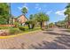 Inviting community entrance with manicured landscaping and a gate, offering a warm welcome to residents and visitors at 6017 Westgate Dr # 924, Orlando, FL 32835