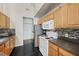 Well-equipped kitchen with stainless steel appliances, ample cabinet space, and black tile flooring at 6017 Westgate Dr # 924, Orlando, FL 32835