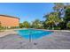 A refreshing community pool featuring a well-maintained deck, lounge chairs, and lush landscaping, perfect for relaxation at 6017 Westgate Dr # 924, Orlando, FL 32835