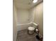 Bathroom featuring a soaking tub and toilet at 4861 Myrtle View N Dr, Mulberry, FL 33860