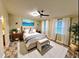 Serene bedroom featuring a ceiling fan, neutral décor, and soft natural light at 4861 Myrtle View N Dr, Mulberry, FL 33860