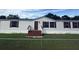 Charming single-story home featuring a cozy front porch and well-maintained lawn at 4861 Myrtle View N Dr, Mulberry, FL 33860