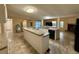 Kitchen featuring an island, modern appliances, and seamlessly connecting to the living area at 4861 Myrtle View N Dr, Mulberry, FL 33860