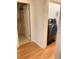 Hallway featuring a laundry area with a washer and dryer, and a bathroom at 223 Windsor St # 6, Lakeland, FL 33803
