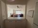 Open living room view showcasing natural light and a partial view of the kitchen at 223 Windsor St # 6, Lakeland, FL 33803