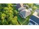 Aerial shot showcasing a fenced backyard with a storage shed, complemented by mature trees for shade and privacy at 10084 Moss Rose Way, Orlando, FL 32832