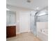 Bright bathroom features a glass enclosed shower and a soaking tub at 10084 Moss Rose Way, Orlando, FL 32832