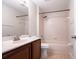 Bathroom with a tub/shower combo and a vanity with double sink at 10084 Moss Rose Way, Orlando, FL 32832