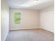 Bedroom with carpet flooring, a window, and a closet with doors at 10084 Moss Rose Way, Orlando, FL 32832