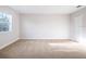 Bedroom with carpet flooring, a window, and a closet door at 10084 Moss Rose Way, Orlando, FL 32832