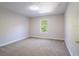 Bedroom featuring neutral carpet, one window, and base molding at 10084 Moss Rose Way, Orlando, FL 32832