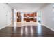 Open-concept kitchen with wooden cabinets, stainless steel appliances, and island seating at 10084 Moss Rose Way, Orlando, FL 32832