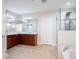 Main bathroom with a double sink vanity, walk-in shower, and soaking tub at 10084 Moss Rose Way, Orlando, FL 32832