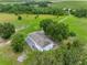 Overhead view of the home nestled among mature trees at 2440 S Wallace Rd, Bartow, FL 33830