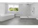 Bathroom with natural light, tub, and walk-in shower at 2440 S Wallace Rd, Bartow, FL 33830
