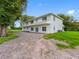 Spacious two-story home with ample parking and verdant landscaping, offering a serene and private setting at 2440 S Wallace Rd, Bartow, FL 33830