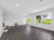 Bright living room featuring hardwood floors, recessed lighting and a picturesque outdoor view at 2440 S Wallace Rd, Bartow, FL 33830