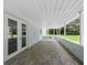 Inviting covered patio with access to backyard, creating a seamless indoor-outdoor living experience at 2440 S Wallace Rd, Bartow, FL 33830