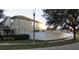 Charming two-story home featuring well-maintained landscaping, complemented by a white vinyl fence for added privacy at 6832 Thornhill Cir, Windermere, FL 34786