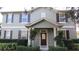 Charming two-story home featuring a well-manicured front yard and a welcoming front porch at 6832 Thornhill Cir, Windermere, FL 34786