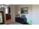 Inviting hallway featuring stylish decor, a black dresser, and a landscape painting at 6832 Thornhill Cir, Windermere, FL 34786