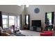 Bright living room with high ceilings, large windows, and stylish furnishings at 6832 Thornhill Cir, Windermere, FL 34786