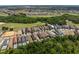 Overview of a vibrant community with beautiful homes surrounded by green spaces, golf course, and various recreational facilities at 852 Desert Mountain Ct, Reunion, FL 34747