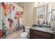 Bathroom featuring a shower with decorative world map curtain and granite counter at 852 Desert Mountain Ct, Reunion, FL 34747
