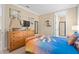 Tastefully decorated bedroom with a comfortable bed, stylish decor, and ensuite bathroom access at 852 Desert Mountain Ct, Reunion, FL 34747