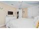 Inviting bedroom with soft lighting, a comfortable bed, and ample storage space at 852 Desert Mountain Ct, Reunion, FL 34747