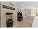 Upper level hallway with arcade game and snack station offers space for relaxation and entertainment at 852 Desert Mountain Ct, Reunion, FL 34747