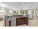 Kitchen with large island, sink, and stainless steel dishwasher at 852 Desert Mountain Ct, Reunion, FL 34747