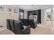 The media room features comfortable seating and a large screen, ideal for movie nights at 852 Desert Mountain Ct, Reunion, FL 34747