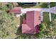 Aerial view of the house with a large yard and new roof at 1938 E Fern Rd, Lakeland, FL 33801