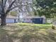 Spacious backyard with a picnic bench, offering plenty of space for outdoor activities at 1938 E Fern Rd, Lakeland, FL 33801