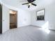 Inviting bedroom showcasing an open doorway and a bright window, flooded with light at 1938 E Fern Rd, Lakeland, FL 33801