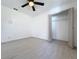 Open bedroom space featuring a ceiling fan and closet, offering a simple design at 1938 E Fern Rd, Lakeland, FL 33801