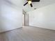 Bright bedroom showcasing modern flooring and neutral walls, ready for personalization at 1938 E Fern Rd, Lakeland, FL 33801
