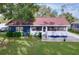 Charming single-story home featuring a cozy front porch and well-maintained lawn at 1938 E Fern Rd, Lakeland, FL 33801