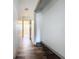 Hallway with hardwood floors and access to other rooms including a closet at 1938 E Fern Rd, Lakeland, FL 33801