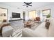 Bright living room with a modern design, featuring hard wood floors and stylish furniture at 1938 E Fern Rd, Lakeland, FL 33801