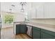 A beautifully renovated kitchen featuring sleek countertops and stainless steel appliances and modern finishes at 818 Cherry Laurel St, Minneola, FL 34715
