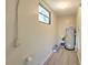A basement with a water heater and wooden flooring shows utility and potential at 475 W Ethelene St, Bartow, FL 33830