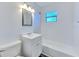 Clean bathroom with white subway tile, vanity, and shower-tub combo at 475 W Ethelene St, Bartow, FL 33830