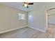 Bedroom featuring a ceiling fan, window, and new floors at 475 W Ethelene St, Bartow, FL 33830