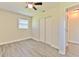 Bedroom featuring gray wood floors, a ceiling fan, and closet space at 475 W Ethelene St, Bartow, FL 33830
